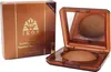 A box of IKOS Teint - Egyptische Erde and an open compact of the bronzer with a mirror. Produktbild-Vorschau