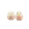 Two chick-shaped night lights in eggshells, presented on a white background. Produktbild-Vorschau
