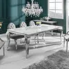 A modern dining room with a marble-top dining table and chrome legs, set against a teal wall. Náhled obrázku produktu