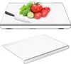 A top-down view of a cutting board with vegetables and a knife, and a separate angled view of the cutting board. Produktbild-Vorschau