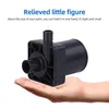 A hand holding a small black pump. Anteprima dell’immagine prodotto