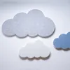 Three felt cloud-shaped acoustic panels are arranged on a white background. Produktbild-Vorschau
