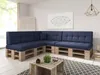A sectional sofa made of wooden pallets with blue cushions in a living room setting. Produktbild-Vorschau