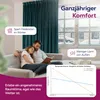 A couple relaxing on a couch in front of a window with snow outside, with text overlays highlighting product benefits. Produktbild-Vorschau
