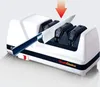 A knife sharpener with a knife being inserted into it. An arrow indicates the direction of insertion. Produktbild-Vorschau