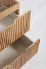 Close-up view of the top two drawers of a wooden cabinet. Produktbild-Vorschau