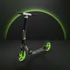 A black and green scooter is displayed against a dark background with a green glowing arch behind it. Náhľad obrázku produktu