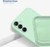 A close-up view of a light green phone case, showing the camera cutout and the interior lining. Produktbild-Vorschau