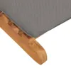 A close-up view of the corner of a grey cushion on a wooden frame. Produktbild-Vorschau
