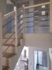 Interior view of a modern house with a staircase and railing. Produktbild-Vorschau