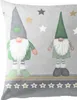 Two gnomes with green hats and green outfits are depicted on a gray background with stars. A decorative border with stars is at the bottom. Produktbild-Vorschau