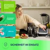 A woman is interacting with a kitchen appliance, surrounded by various accessories and food items. Anteprima dell’immagine prodotto