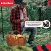 A man in a forest is holding a basket full of mushrooms. Anteprima dell’immagine prodotto
