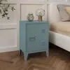 A blue locker-style nightstand is placed next to a bed in a bedroom. Anteprima dell’immagine prodotto