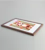 A framed picture of a woman with polka dots in the background, placed on a light gray surface. Produktbild-Vorschau