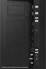 Close-up view of the ports and connections on the back of a television. Voir les images du produit