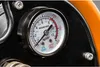 A close-up of a pressure gauge on a piece of machinery. Produktbild-Vorschau
