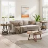 A living room scene with a sofa, coffee table, and side tables. Produktbild-Vorschau