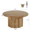 A round coffee table with a fluted base, shown with dimensions and a scale reference. Produktbild-Vorschau