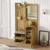 A hallway or entryway with a wooden furniture set including a bench, shoe storage, and a mirror. Produktbild-Vorschau