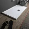A white rectangular shower tray is shown on a wooden floor, with black flip-flops in the foreground. Anteprima dell’immagine prodotto
