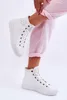 A person wearing white high-top sneakers and pink pants. Produktbild-Vorschau