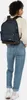 A person wearing a backpack and jeans. Anteprima dell’immagine prodotto