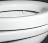 A close-up view of the top rim and seat of a white toilet. Produktbild-Vorschau