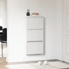 A white shoe cabinet with three flip-down doors mounted on a white wall. Anteprima dell’immagine prodotto