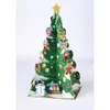 A 3D pop-up Christmas tree decoration with various ornaments and a snowman at the base, set against a white background. Produktbild-Vorschau