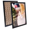 Two black picture frames, one showing the back with a patterned insert and the other showing a cat photo. Produktbild-Vorschau