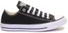 A black Converse All Star shoe on a white background. Voir les images du produit