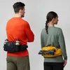 Two people, a man and a woman, are shown from the back, wearing hip packs. Náhľad obrázku produktu