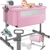 A pink baby bassinet with a baby and a teddy bear inside, shown with various accessories and features highlighted. Produktbild-Vorschau