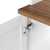 A close-up view of a cabinet hinge and a wooden shelf. Náhled obrázku produktu