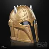 A golden helmet with silver spikes on a black background. Anteprima dell’immagine prodotto