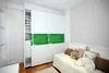 A bedroom with a wardrobe and a daybed decorated with stuffed animals. Produktbild-Vorschau