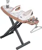 A toy ironing board set with two toy irons, a spray bottle, and hangers, displayed on a white background. Produktbild-Vorschau