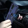 A blue phone case with a ring holder is being attached to a magnetic car mount on a car's air vent. Produktbild-Vorschau