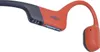 Close-up of a pair of red and dark gray Shokz sports headphones. Náhľad obrázku produktu