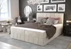 A stylish bedroom with a large bed, a round mirror, and wall art. Náhled obrázku produktu