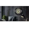 A modern office desk with a computer monitor, a desk lamp, and a decorative clock on the wall. Produktbild-Vorschau