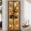 A corner display cabinet filled with bottles and decorative items, illuminated by internal LED lights. Produktbild-Vorschau