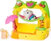 A toy playset designed to look like a tropical fruit stand with a character relaxing in a hammock. Náhled obrázku produktu