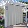 An outdoor patio with a pergola covered by a gray curtain. Náhľad obrázku produktu