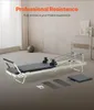 A Pilates reformer machine is shown in a room with a window and a ball. Voir les images du produit