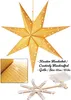 A golden star-shaped lantern with small star cutouts, illuminated from within, is shown hanging. A close-up of the lantern's texture and a disassembled star frame with battery pack are also visible. Podgląd zdjęcia produktu