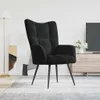 A black velvet armchair is shown in a well-lit room with a minimalist aesthetic. Voir les images du produit