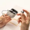 Hands holding a charging case and earbuds for Samsung Galaxy Buds 3 / 3 Pro. Produktbild-Vorschau