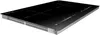 A black induction cooktop with silver trim, shown from a diagonal angle against a white background. Voir les images du produit